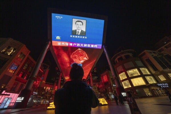 The evening news broadcast shows an obituary photo of the former Premier Li Keqiang on a giant LED screen in Beijing, Friday, Oct. 27, 2023. The sudden death of China's former second-ranking leader, Li Keqiang, has shocked many people in the country, with tributes offered up to the ex-official who promised market-oriented reforms but was politically sidelined. (AP Photo/Ng Han Guan) The evening news broadcast shows an obituary photo of the former Premier Li Keqiang on a giant LED screen in Beijing, Friday, Oct. 27, 2023. The sudden death of China's former second-ranking leader, Li Keqiang, has shocked many people in the country, with tributes offered up to the ex-official who promised market-oriented reforms but was politically sidelined. (AP Photo/Ng Han Guan)
