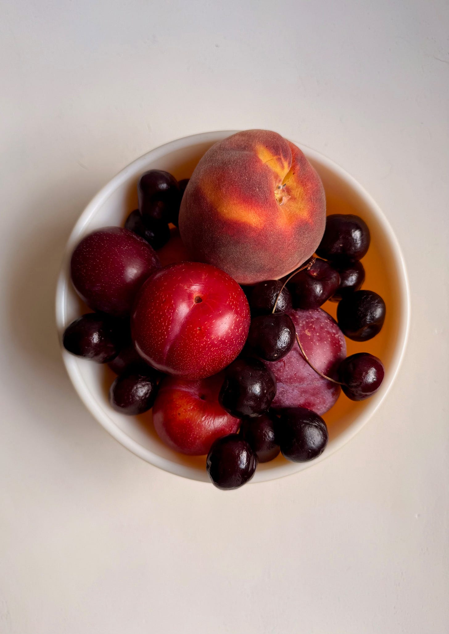 a white bowl witt fruit in it. Studiodelicious.com 