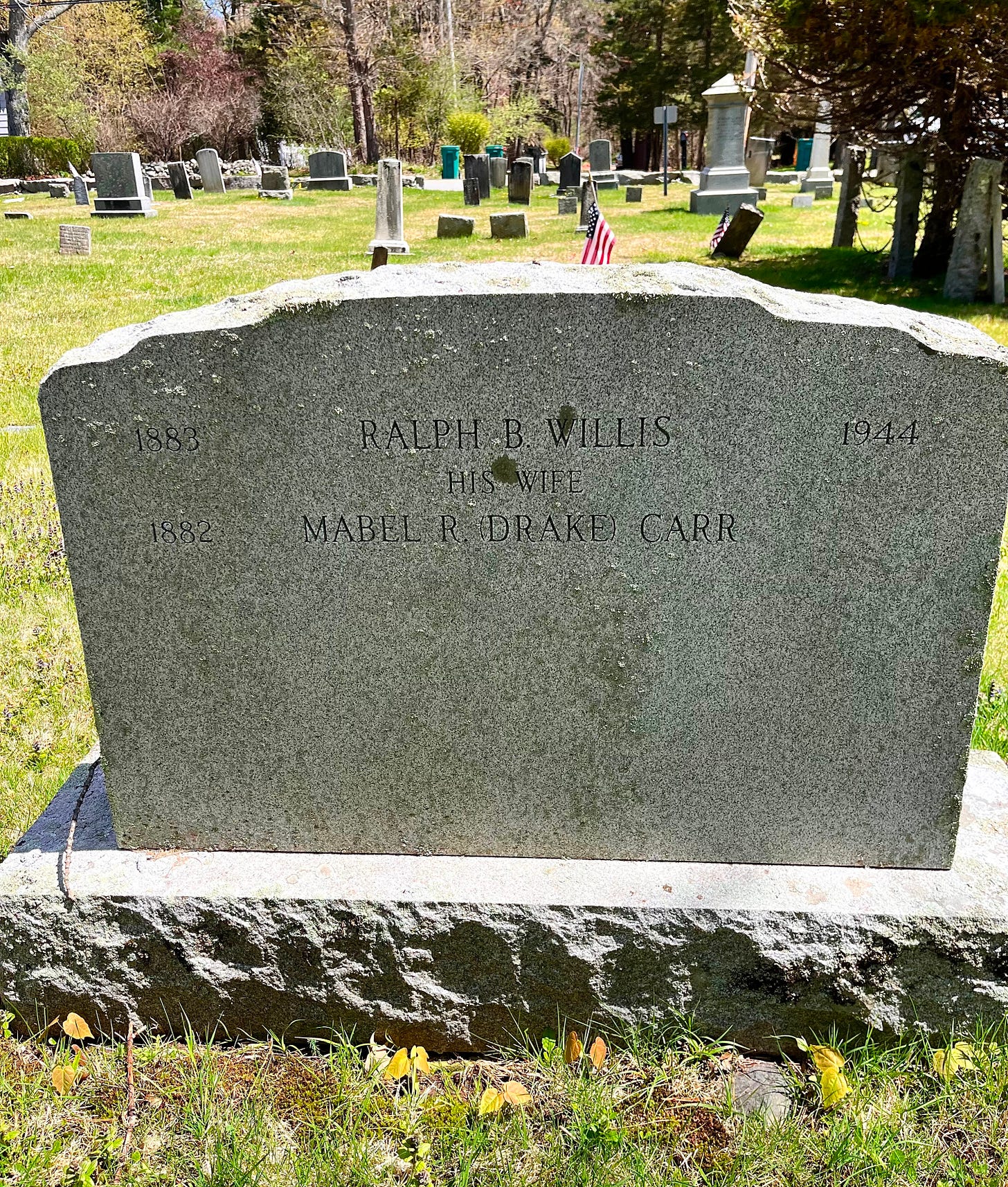 A gravestone marker for Ralph B. Willis, died 1944, and his wife, Mabel R. Drake Carr.