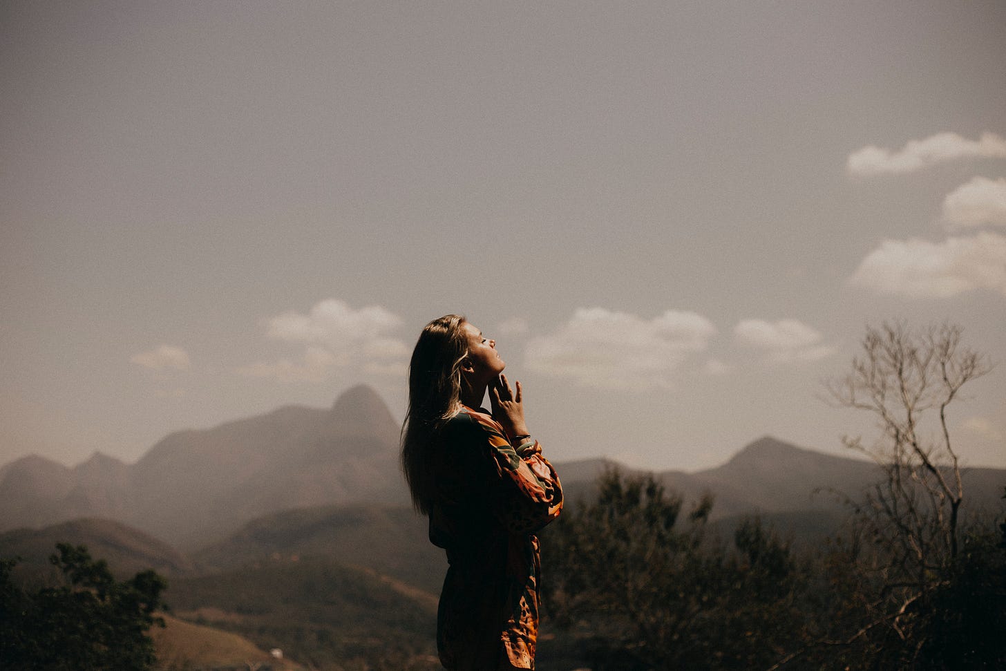 Woman looking heavenward in the wilderness Woman looking heavenward in the wilderness