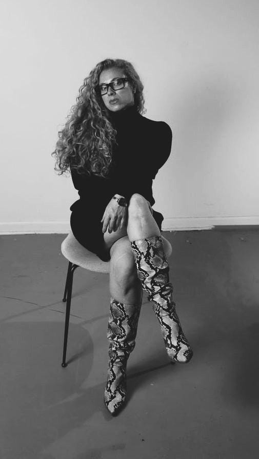 A person sitting on a chair

Description automatically generated