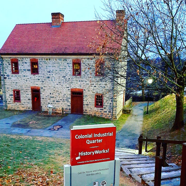 Old stone buildings, including a blacksmith shop, stand in Bethlehem PA.