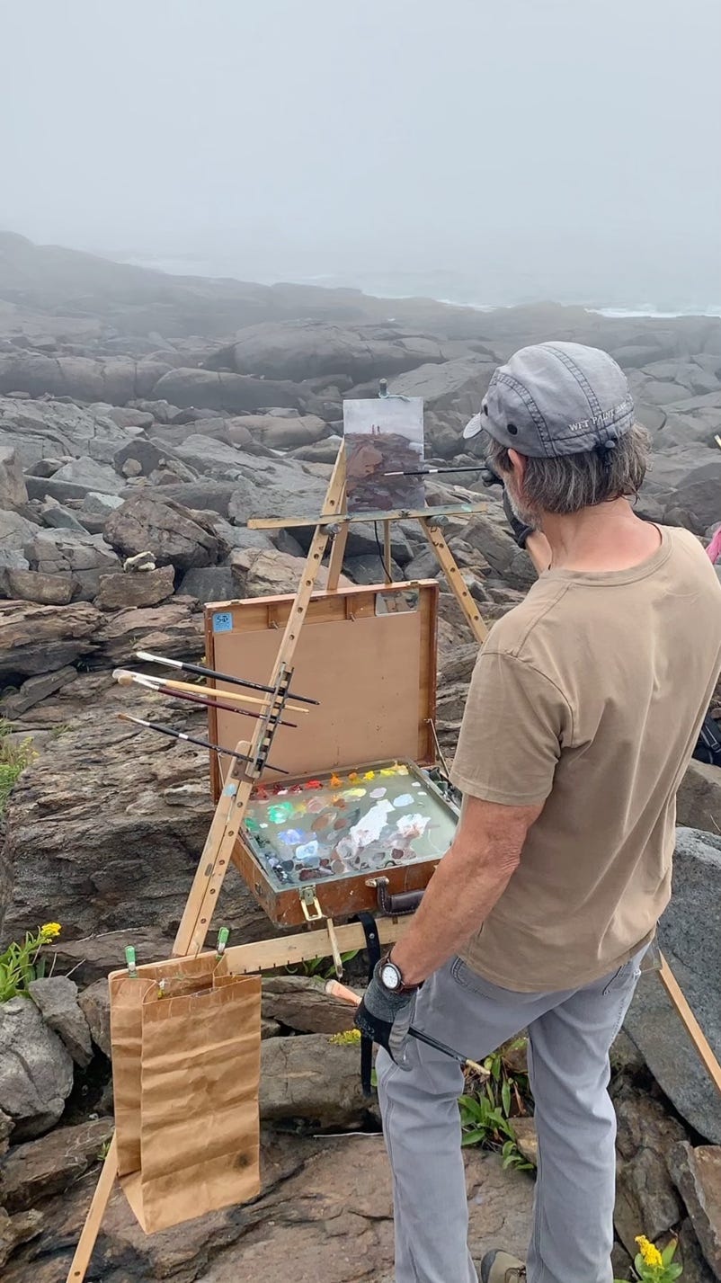 A person painting outside

Description automatically generated