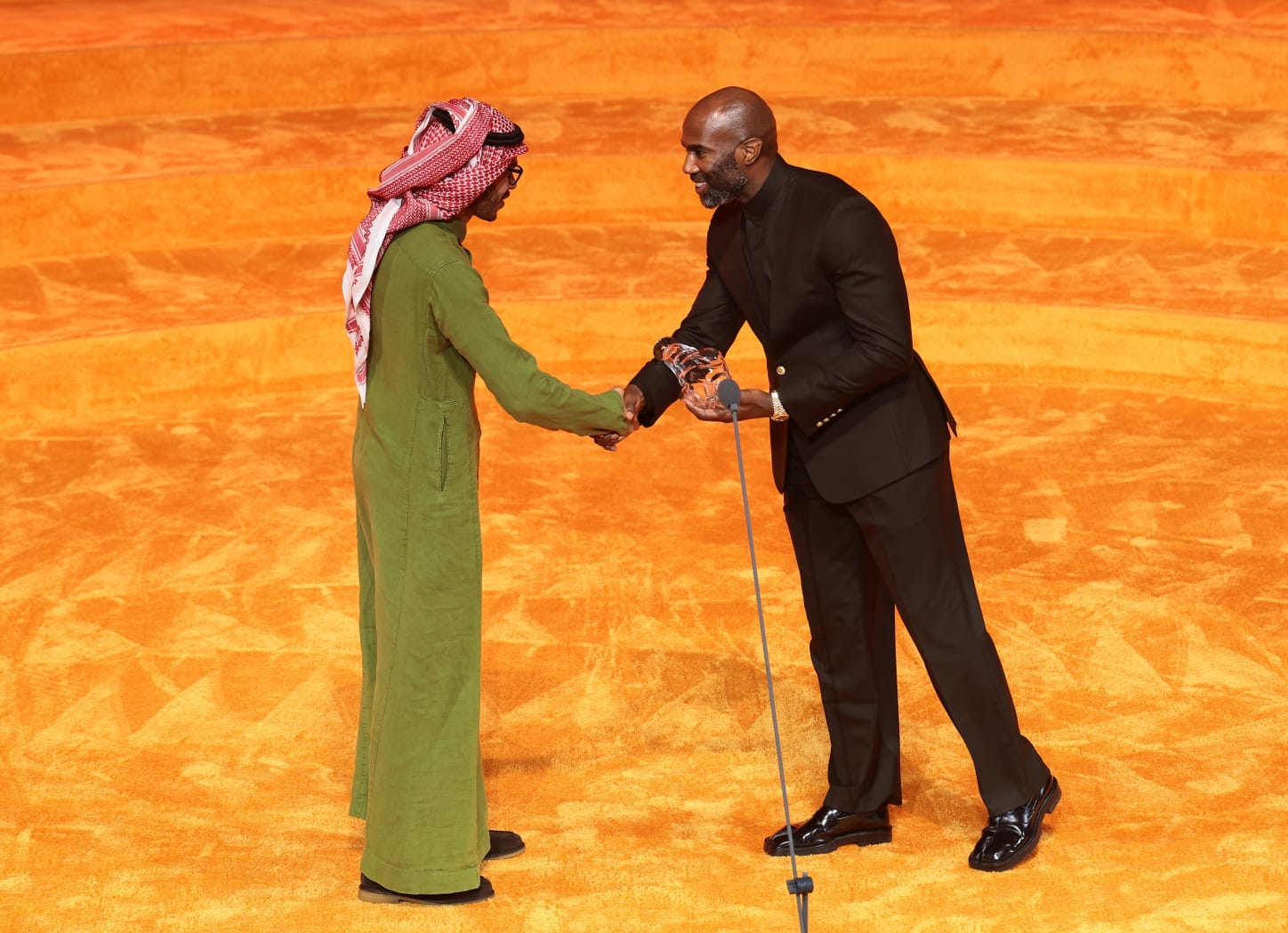 MIAMI BEACH, FLORIDA - DECEMBER 04: (L-R) Mohammad Al Faraj and Malcolm Jenkins speak during the Art Basel Awards Miami Beach Ceremony at New World Symphony on December 04, 2025 in Miami Beach, Florida. Photograph by Dimitrios Kambouris/Getty Images for Art Basel. MIAMI BEACH, FLORIDA - DECEMBER 04: (L-R) Mohammad Al Faraj and Malcolm Jenkins speak during the Art Basel Awards Miami Beach Ceremony at New World Symphony on December 04, 2025 in Miami Beach, Florida. Photograph by Dimitrios Kambouris/Getty Images for Art Basel.