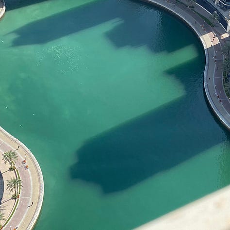 Images of large solar panel trees, post-modern architecture and the reflections of high rises in Dubai.