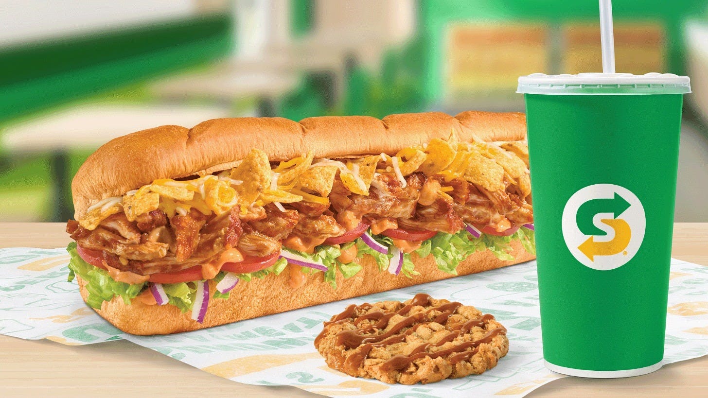 The Fritos Chicken Enchilada Sub and Caramel Apple Cookie. Image: Subway