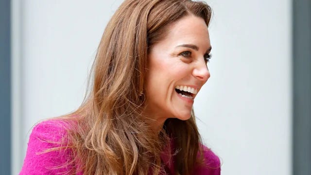 Princess Catherine laughing in a pink coat
