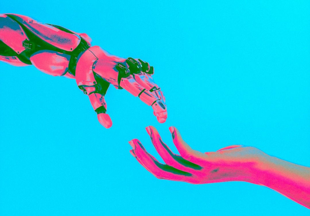 two hands reaching for a flying object in the sky