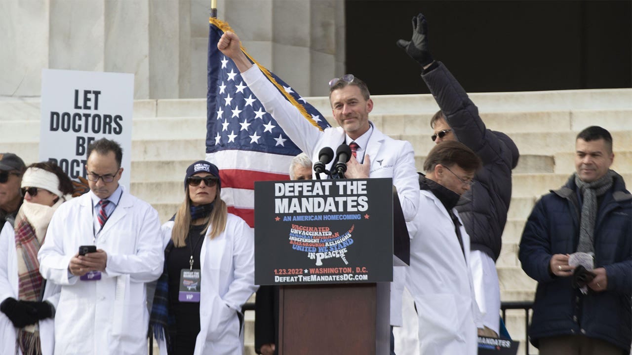 A photo of Ryan Cole, MD, speaking at a Defeat The Mandates rally in Washington, DC. A photo of Ryan Cole, MD, speaking at a Defeat The Mandates rally in Washington, DC.