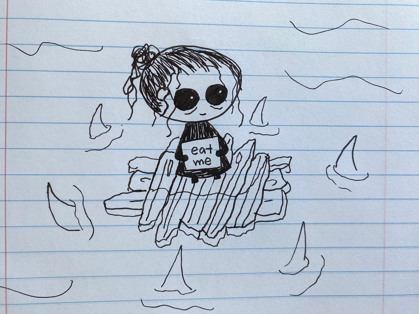 A cartoon drawing in black ink on notebook paper of an exhausted-looking, big-headed, big-eyed figure seated atop a raft of splintered wood, lost at sea. The fins of six sharks circle the raft. The figure holds a sign that reads “eat me.”