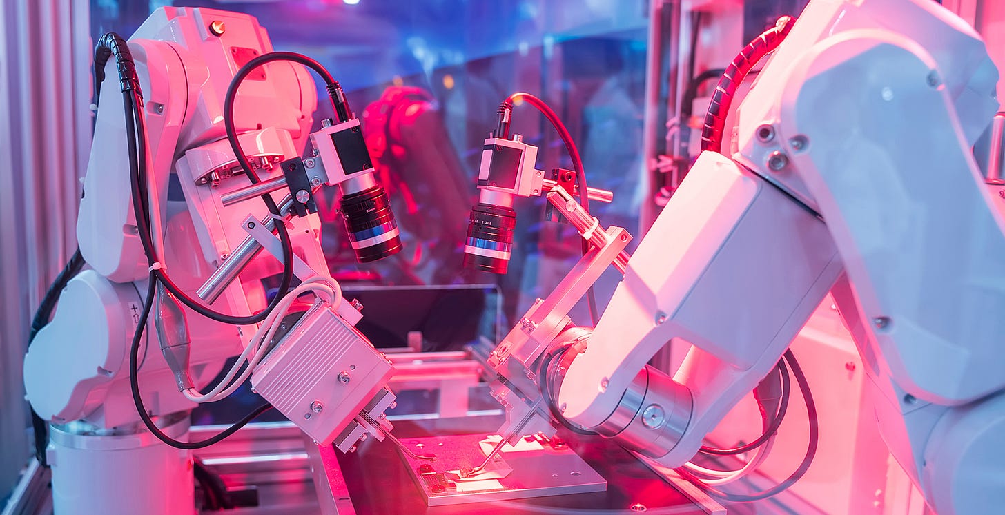 Two robots on high-tech factory assembly line