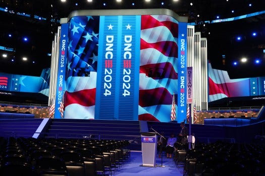 Workers put the final touches on the stage for the Democratic National Convention at the United Center in Chicago on Aug. 15, 2024. One week before Vice President Kamala Harris is set to accept her party’s presidential nomination, Democratic National Convention officials and Chicago Mayor Brandon Johnson took to the United Center floor Thursday to unveil the stage where Harris will deliver her history-making address. The speakers' lectern rises from the floor. “We’ve been working for over a year to build the figurative and now literal stage for our party and our nominees,” said Alex Hornbrook, executive director of the Democratic National Convention Committee.
