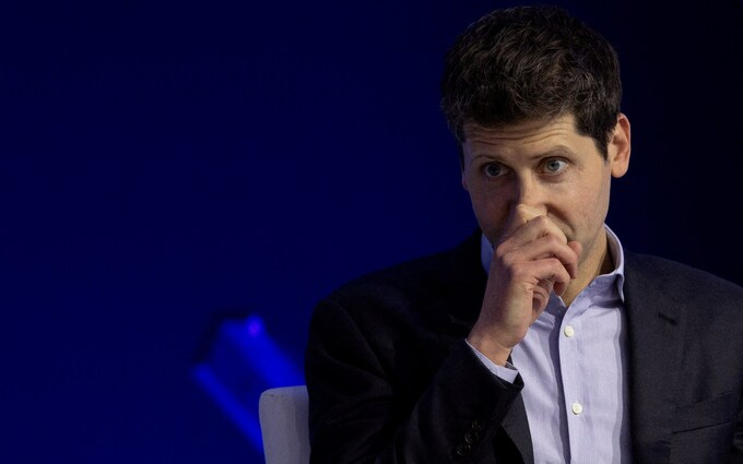 Sam Altman, OpenAI former CEO, with his hand over his mouth looking worried Sam Altman, OpenAI former CEO, with his hand over his mouth looking worried
