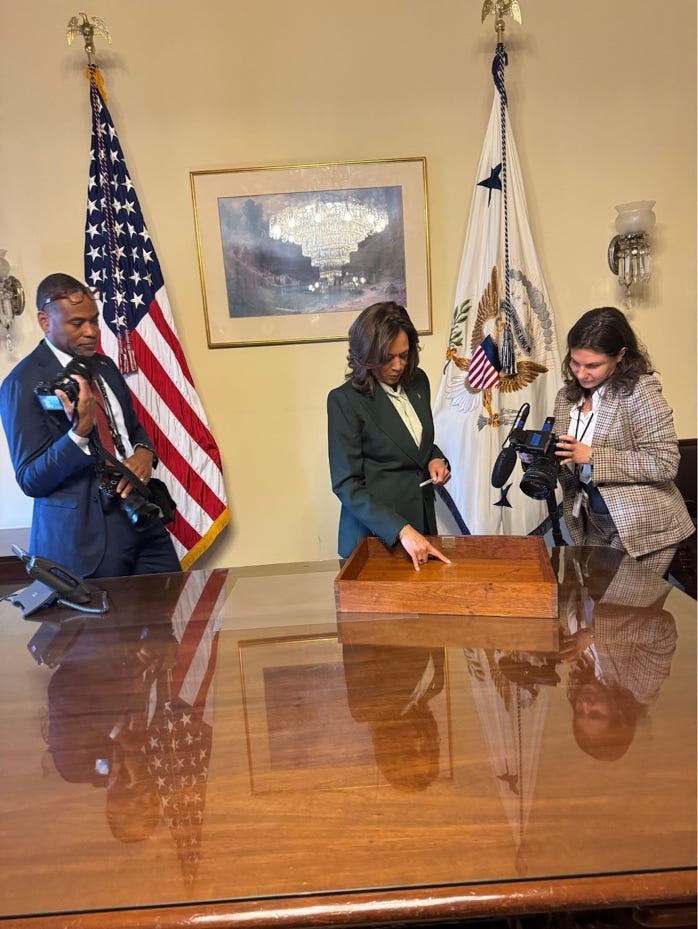 A group of people standing around a table

AI-generated content may be incorrect.