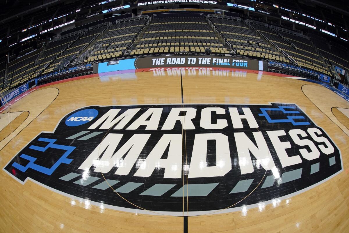 The basketball court at PPG Paints Arena in Pittsburgh is prepared with a March Madness logo.
