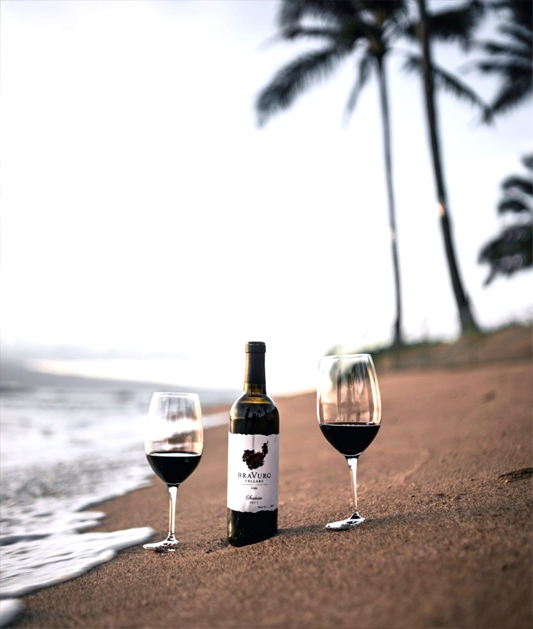 wine bottle on beach shore during daytime