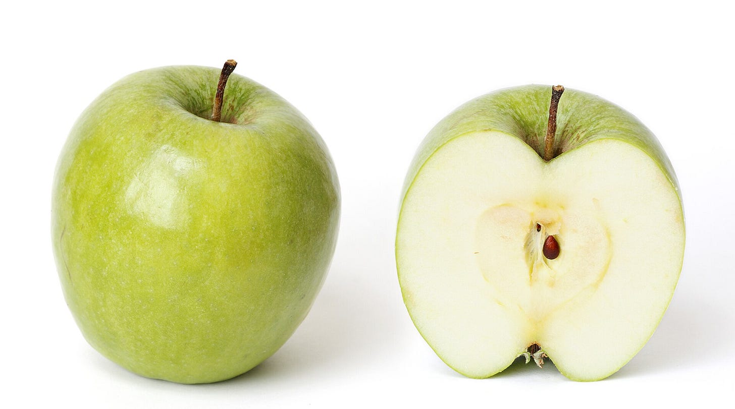 A green apple, the object Magritte used to hide the man's face A green apple, the object Magritte used to hide the man's face
