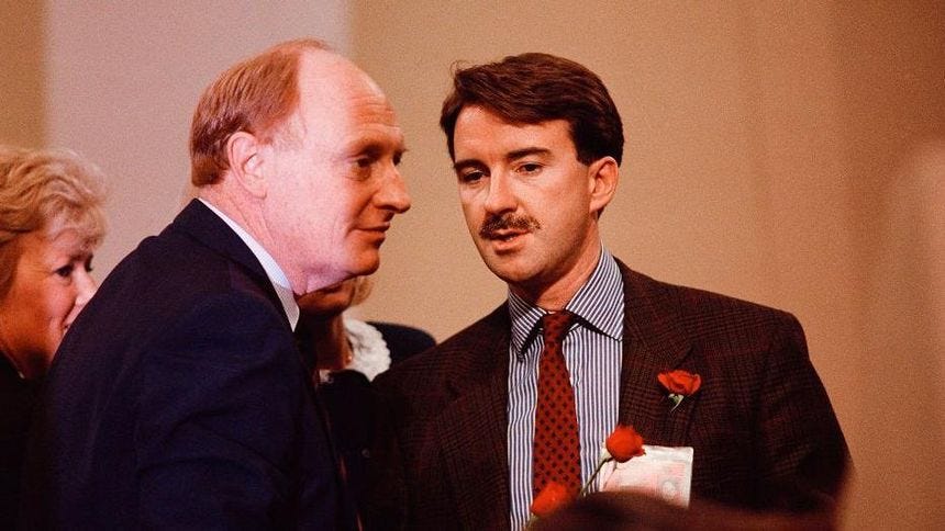 Then Labour leader Neil Kinnock confers with a moustachioed Peter Mandelson in 1989. Both men are wearing dark suits Then Labour leader Neil Kinnock confers with a moustachioed Peter Mandelson in 1989. Both men are wearing dark suits