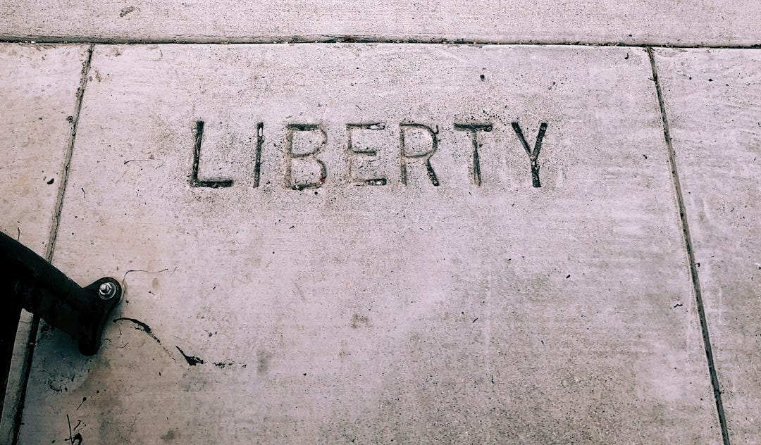 a sidewalk with the word liberty written on it