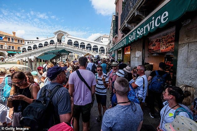 Visitor-only routes to popular landmarks were introduced to keep tourists away from the locals. The visitor-only routes were put in place for tourists heading to St Mark's Square and the Rialto Bridge (pictured) Visitor-only routes to popular landmarks were introduced to keep tourists away from the locals. The visitor-only routes were put in place for tourists heading to St Mark's Square and the Rialto Bridge (pictured)