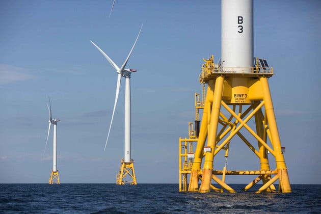 Offshore wind turbines stand in the water. Offshore wind turbines stand in the water.