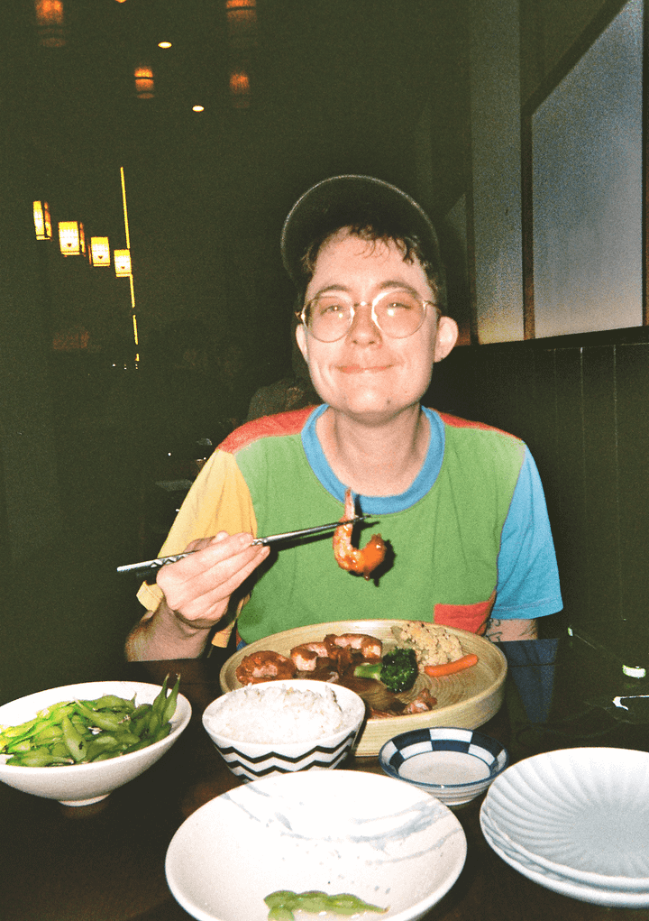 Film photos of my friend at a sushi restaurant, a brick graffitied building in Manhattan, the on-set photographer for my friend's short film, and some fans after Knicks finals game 4