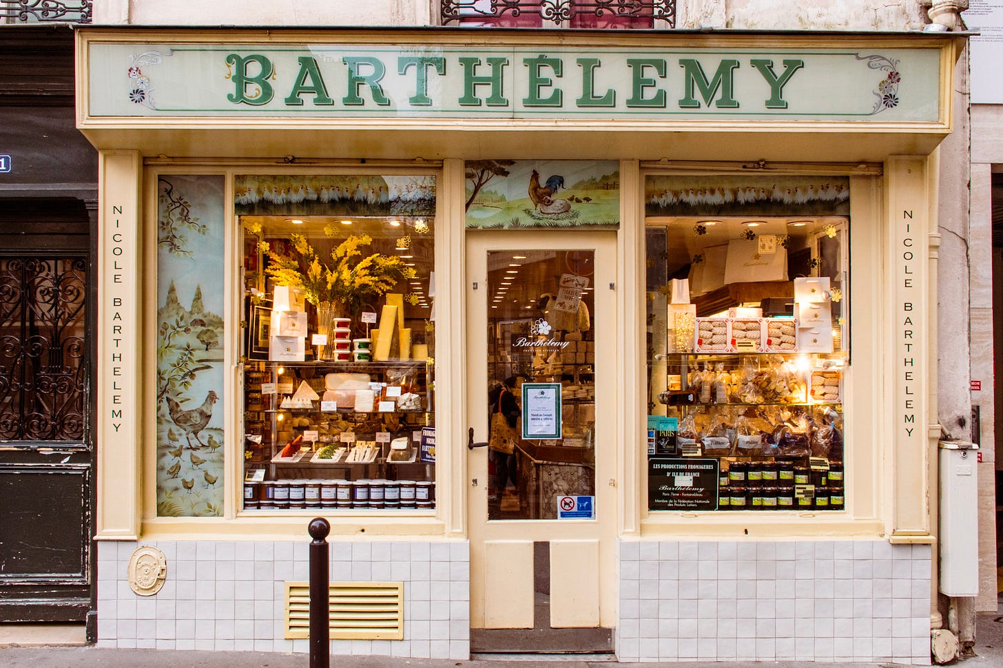 The historic storefront of Barthélémy on Rue de Grenelle, a renowned Paris cheese shop known for its exceptional French cheeses. The historic storefront of Barthélémy on Rue de Grenelle, a renowned Paris cheese shop known for its exceptional French cheeses.