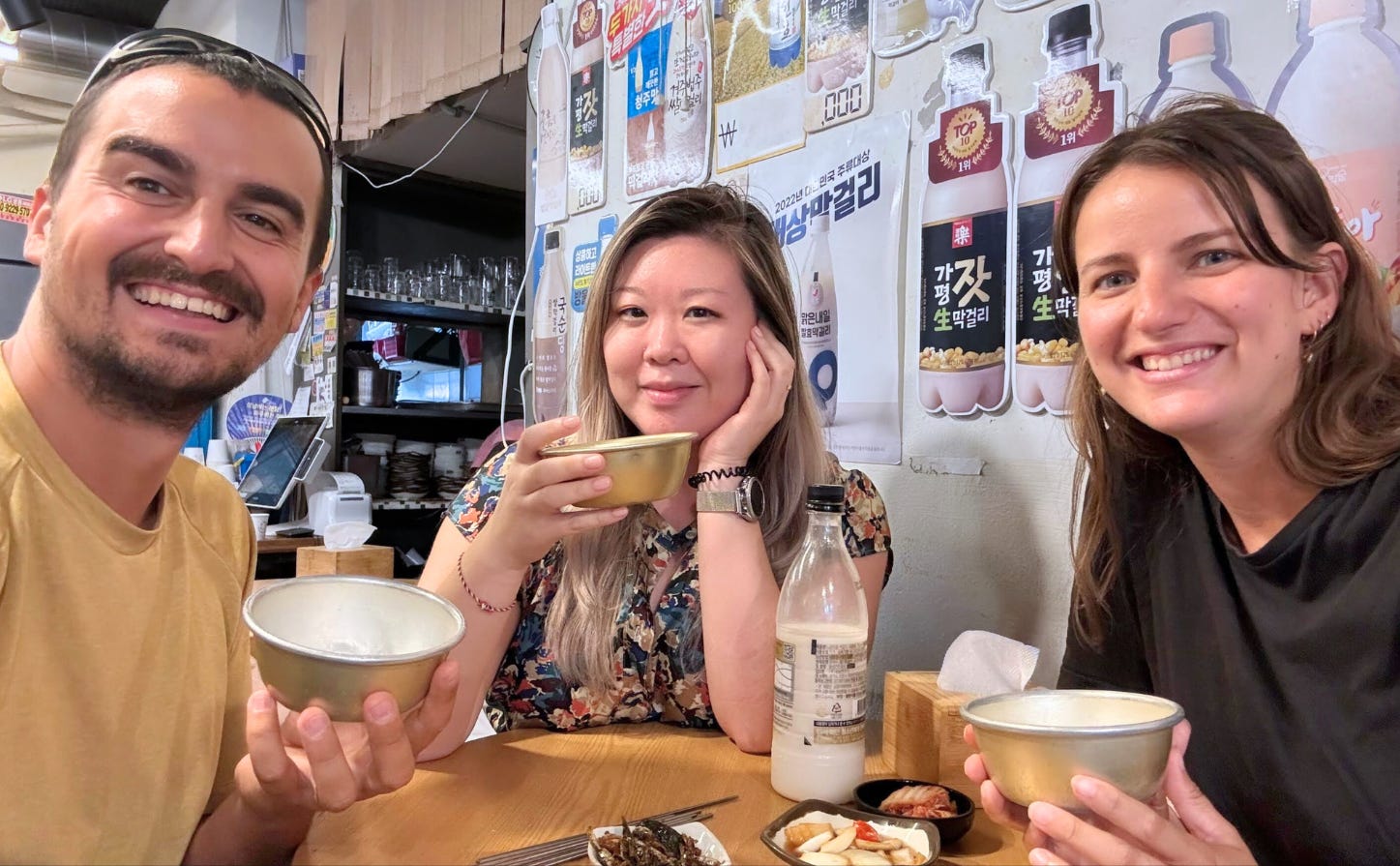 Group of three enjoying refreshments. Group of three enjoying refreshments.
