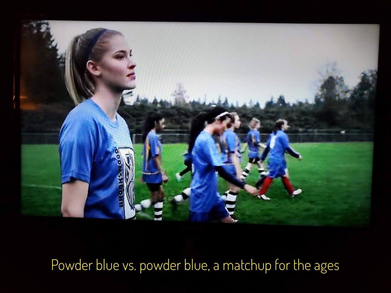 Denise looking regretful on the field. Both teams are wearing powder blue jerseys, captioned "Powder blue vs. powder blue, a matchup for the ages"