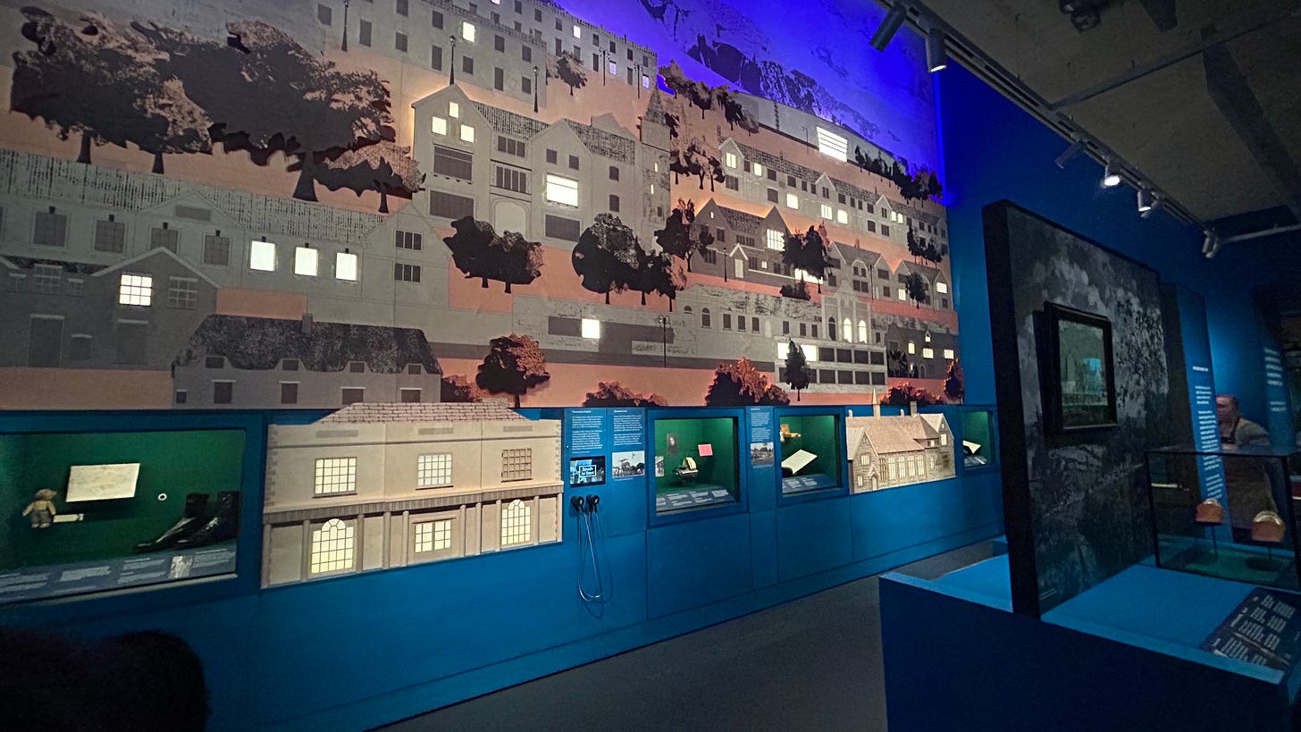 The illuninated back wall of Clarks Shoemakers Museum. It is made up of buildings with their windows illuminated at night. The illuninated back wall of Clarks Shoemakers Museum. It is made up of buildings with their windows illuminated at night.