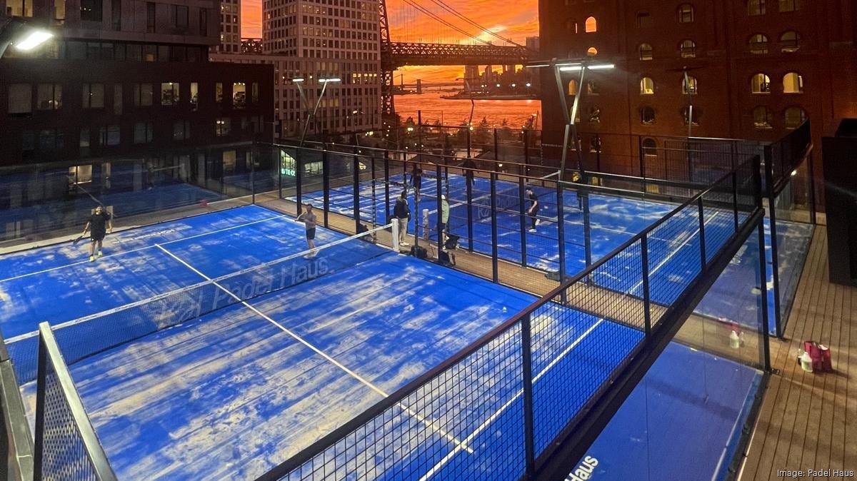 Rooftop padel court at sunset at Padel Haus Williamsburg Rooftop padel court at sunset at Padel Haus Williamsburg