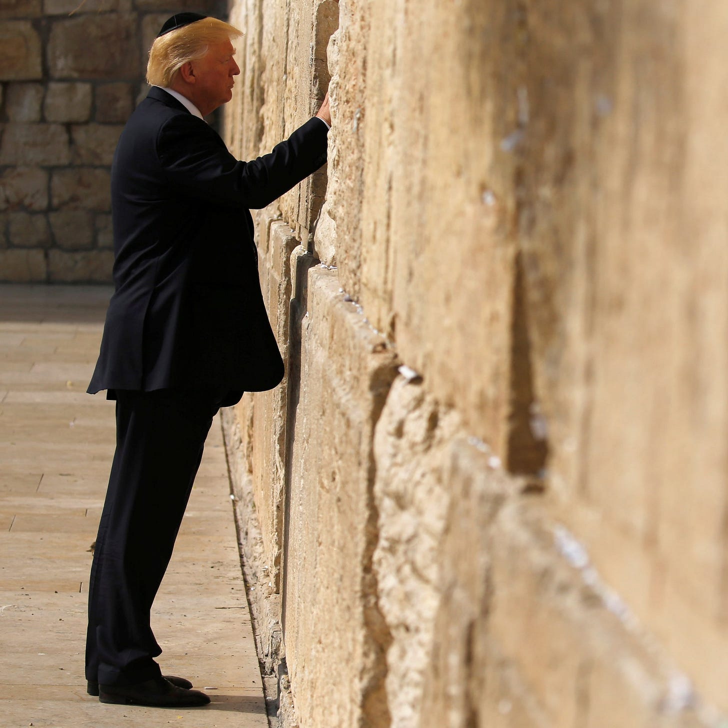 In U.S. presidential first, Trump prays at Jerusalem's Western Wall |  Reuters