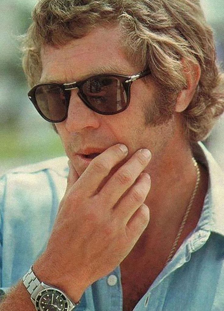 This may contain: a man with sunglasses on his face and hand to his chin looking at the camera This may contain: a man with sunglasses on his face and hand to his chin looking at the camera