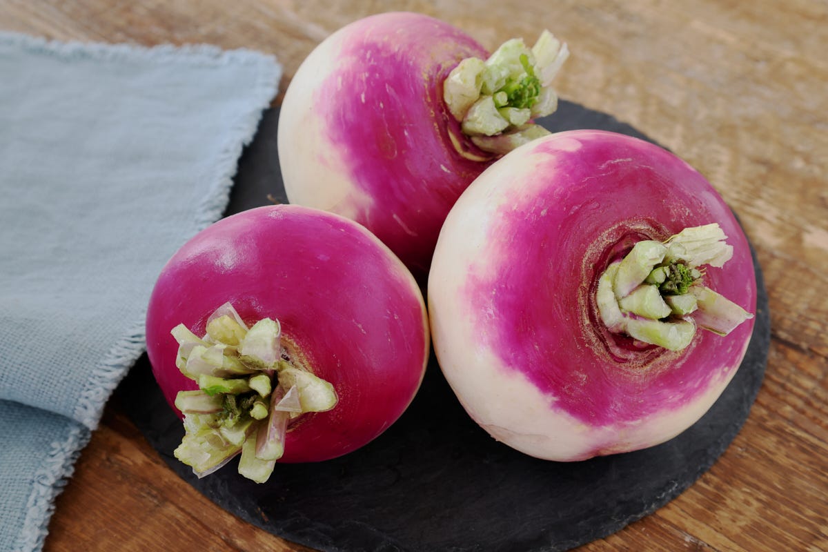 turnips on a platter with a napkin alongside turnips on a platter with a napkin alongside