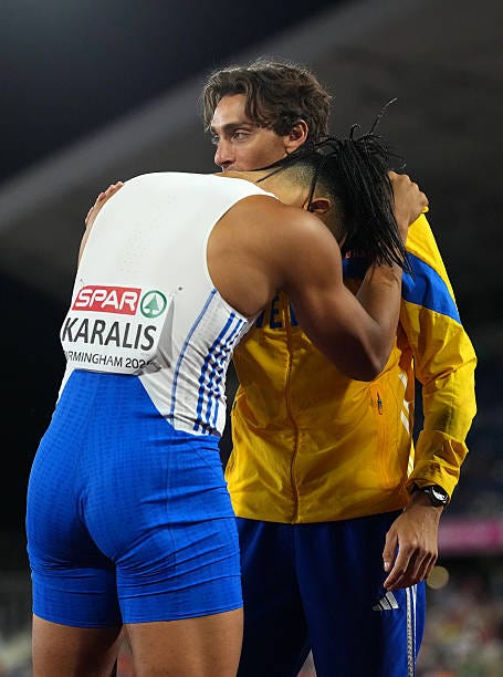 Gold medalist Armand Duplantis of Team Sweden and Silver medalist Emmanouil Karalis of Team Greece embrace after the Men's Pole Vault Final during...