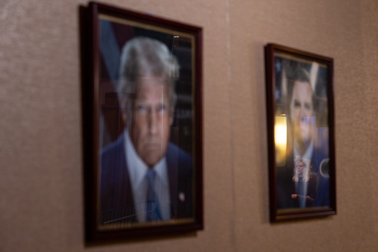 Pam Bondi, US attorney general, reflected in a portrait of Vice President JD Vance during a news conference at the Department of Justice (DOJ) in Washington, DC, US, on Wednesday, Nov. 19, 2025. Ten defendants have been arrested in a federal grand jury indictment charging a former Olympic snowboarder, and others, in connection with the murder of a federal witness in a different criminal case. Photographer: Eric Lee&#x2F;Bloomberg