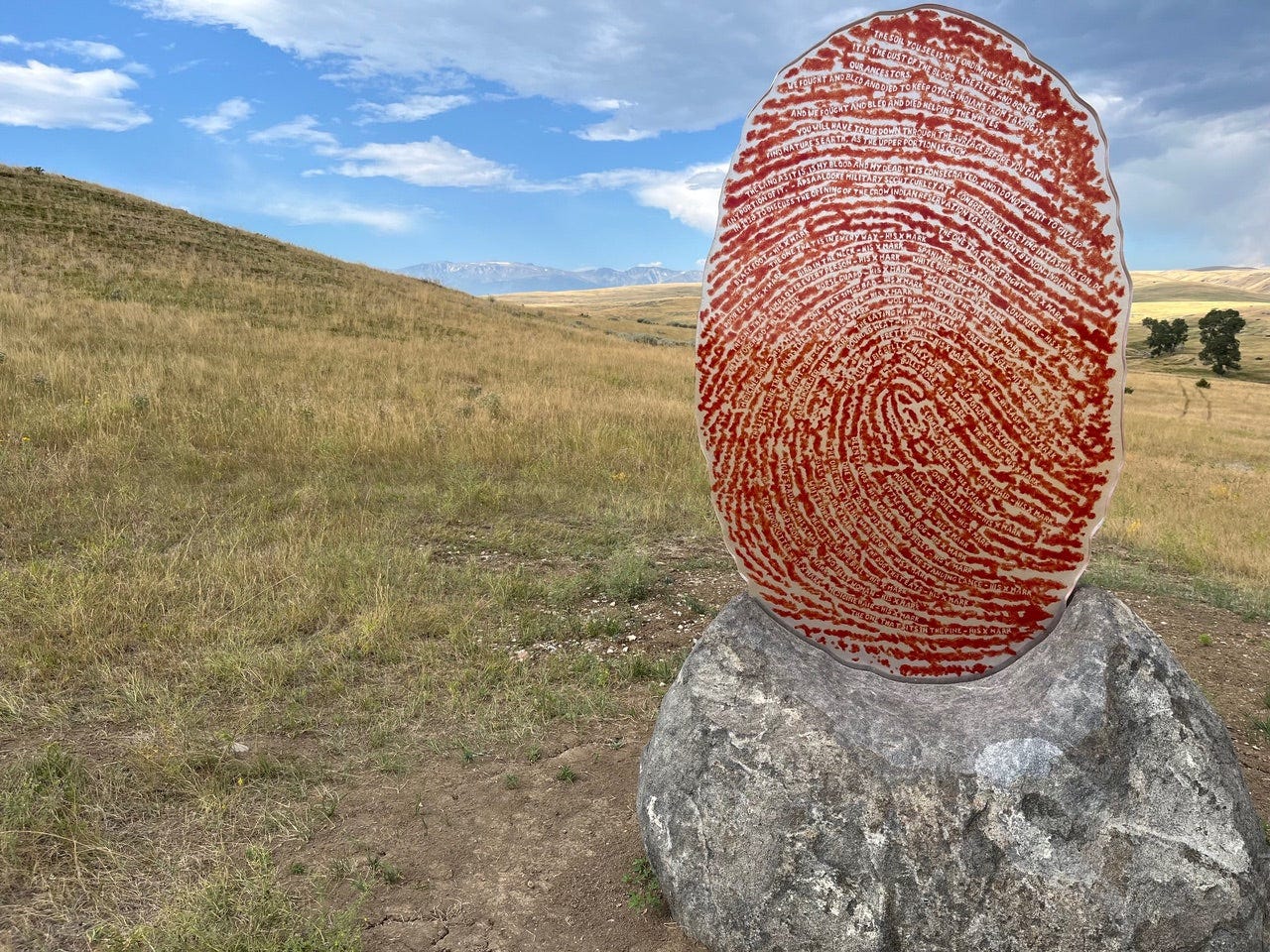 Wendy Red Star, 'The Soil You See,' (2023) at Tippet Rise with the Beartooth Mountains barely visible in the background. Wendy Red Star, 'The Soil You See,' (2023) at Tippet Rise with the Beartooth Mountains barely visible in the background.