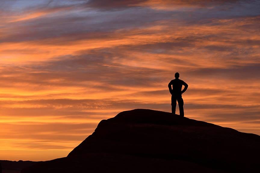 Taking in a sunset on the rocks in Arches. Photo credit Michael Ambrose.