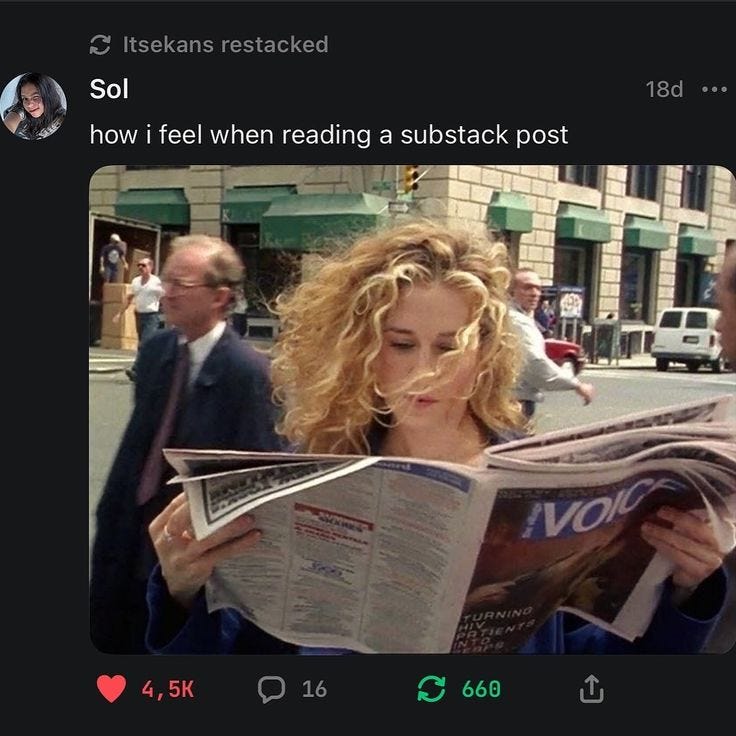 This may contain: a woman reading a newspaper on the street