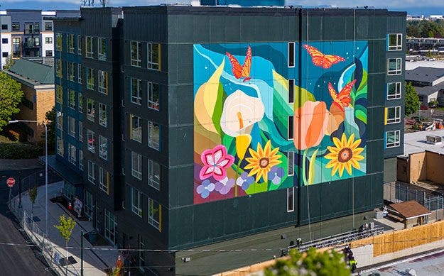 A building with a mural on the side
Description automatically generated A building with a mural on the side
Description automatically generated