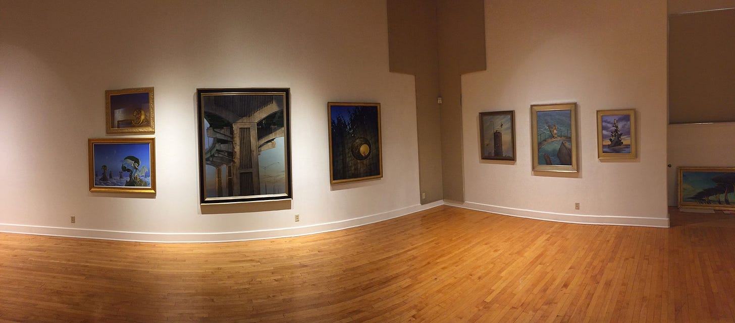 A sweeping panoramic photo sweeping across one corner of the gallery at the Riverside Art Museum. The juxtaposition of paintings gives a real sense of scale with gallery art like THE BIG QUESTION occupying more space than THE WHITE DRAGON and A PRINCESS OF MARS combined. This represents only a fraction of the 50 paintings that were displayed.