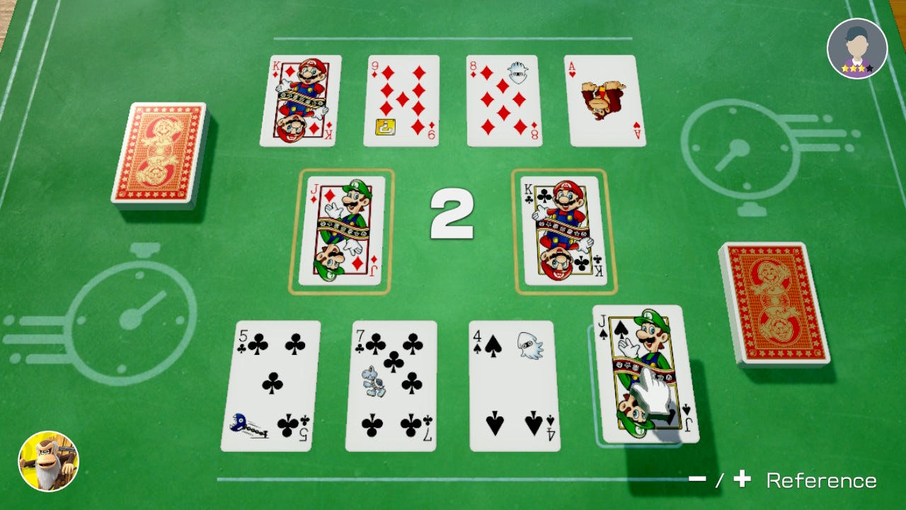 Speed in Clubhouse Games. There are two cards center. Below, there are four cards for the player to use. Above, there are four cards for the opponent. There is a stack of cards on each player's side.