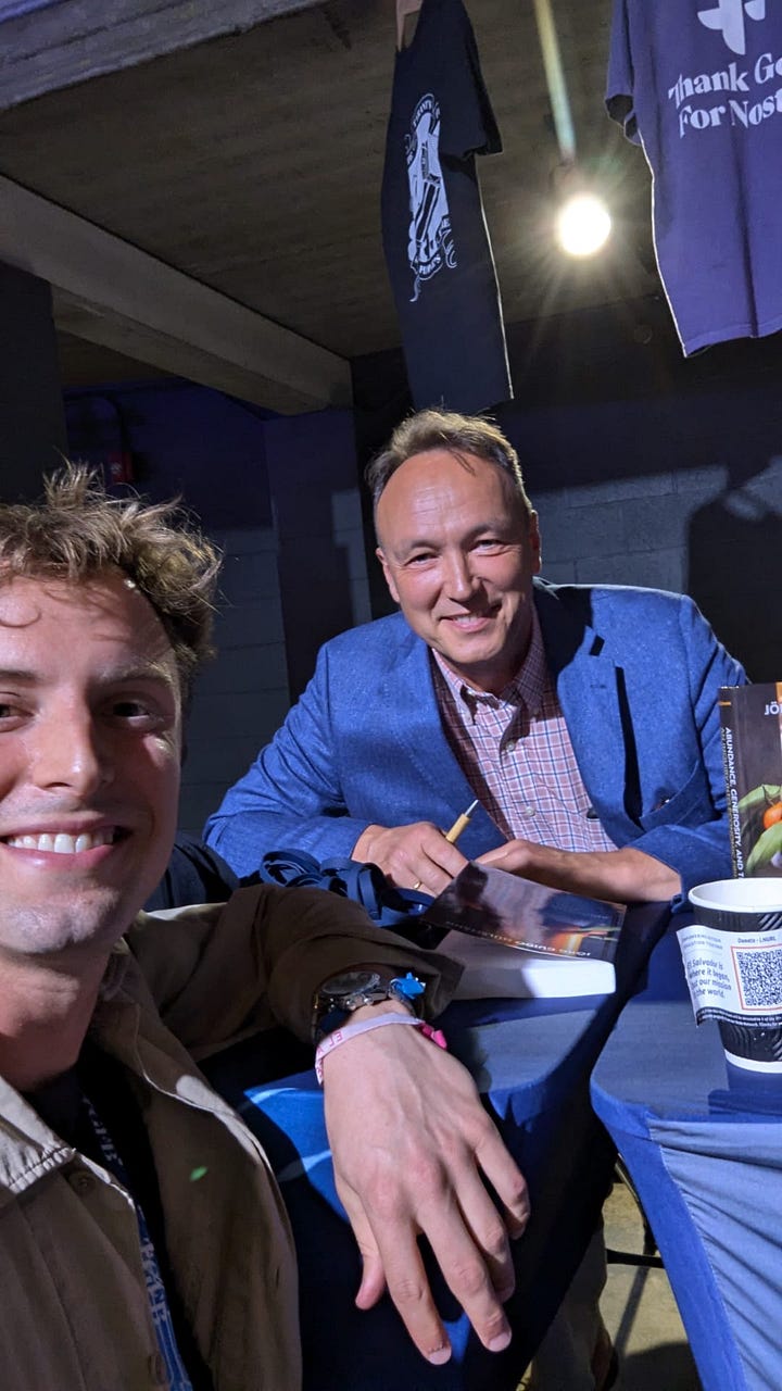 Left: Cover of The Ethics of Money Production. Right: David and Prof. Dr. Hülsmann at a conference in 2024.