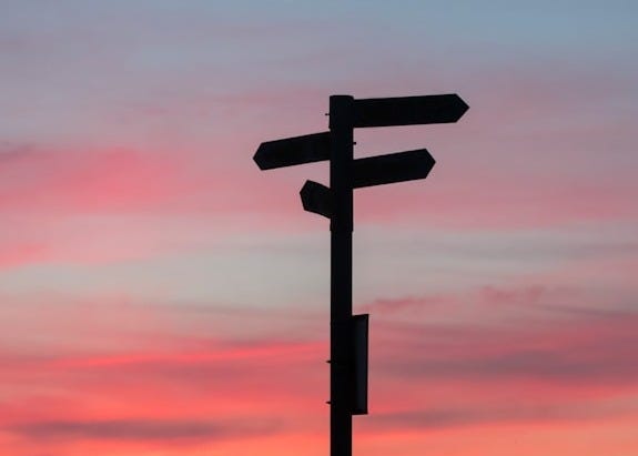 silhouette of road signage during golden hour