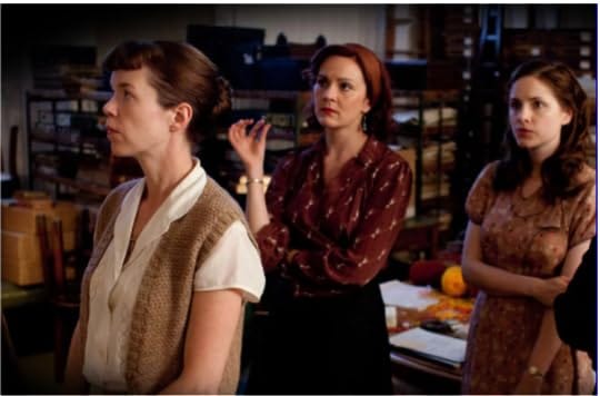 Three women looking off camera.