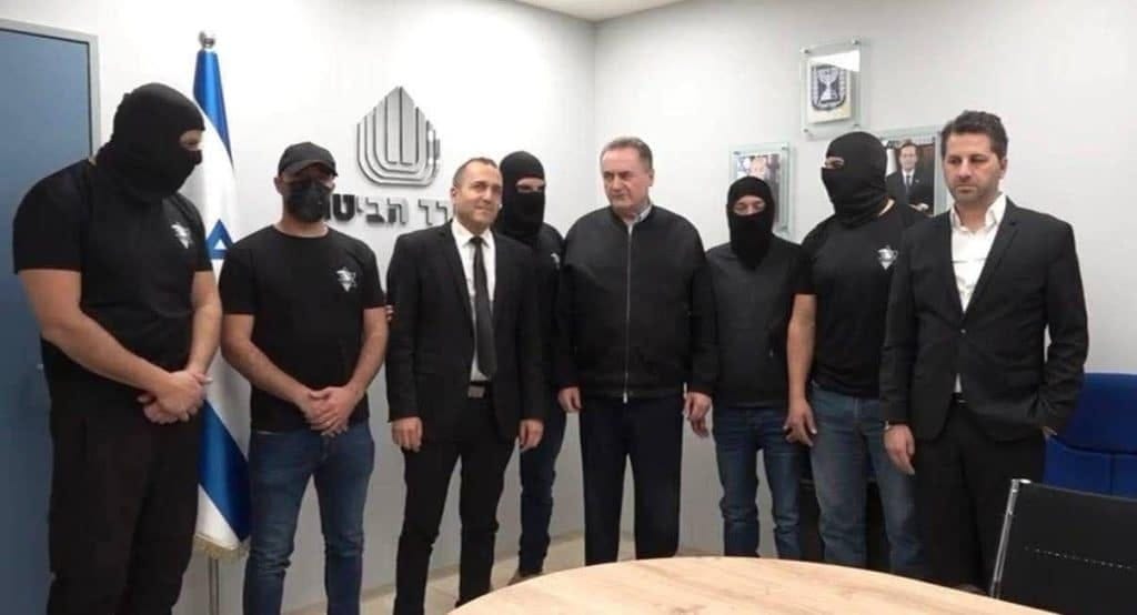 Israel Katz (center) meeting with the Sde Teiman rapists (wearing masks). (Photo: social media)