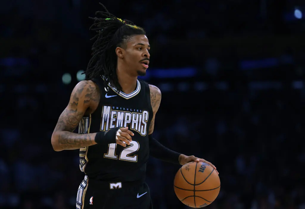 LOS ANGELES, CALIFORNIA - APRIL 22: Ja Morant #12 of the Memphis Grizzlies brings the ball up court during a 111-101 Los Angeles Lakers win in Game Three of the Western Conference First Round Playoffs at Crypto.com Arena on April 22, 2023 in Los Angeles, California. NOTE TO USER: User expressly acknowledges and agrees that, by downloading and or using this photograph, User is consenting to the terms and conditions of the Getty Images License Agreement. (Photo by Harry How/Getty Images) LOS ANGELES, CALIFORNIA - APRIL 22: Ja Morant #12 of the Memphis Grizzlies brings the ball up court during a 111-101 Los Angeles Lakers win in Game Three of the Western Conference First Round Playoffs at Crypto.com Arena on April 22, 2023 in Los Angeles, California. NOTE TO USER: User expressly acknowledges and agrees that, by downloading and or using this photograph, User is consenting to the terms and conditions of the Getty Images License Agreement. (Photo by Harry How/Getty Images)