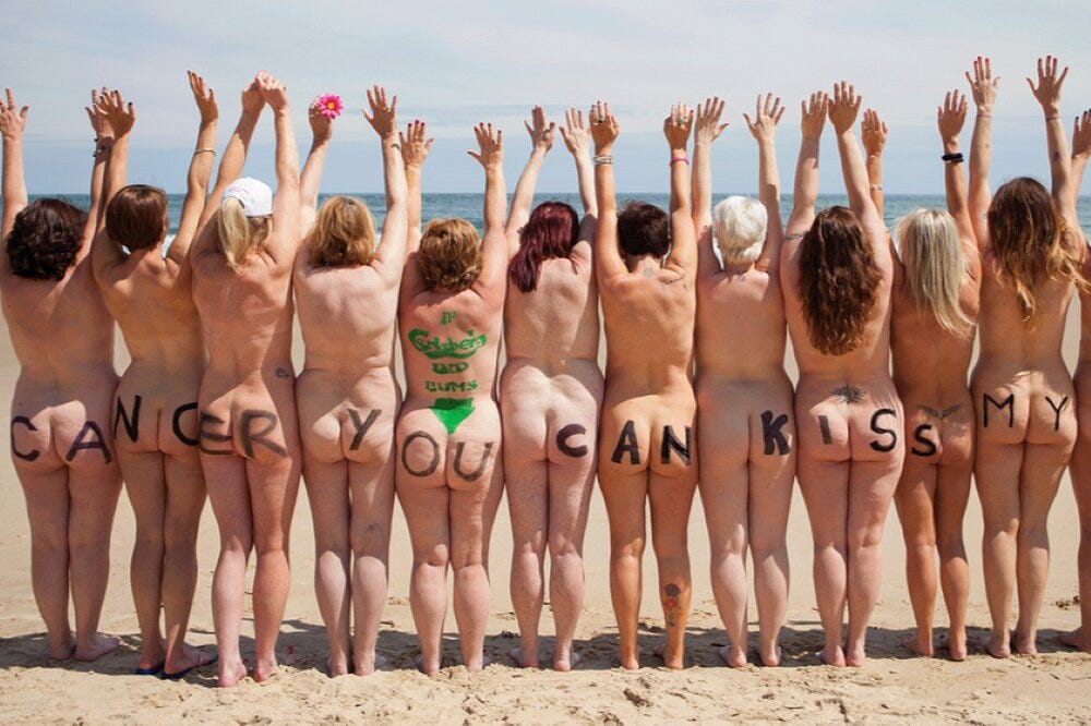 Participants gather on the shore for the Strip and Dip charity skinny dip.