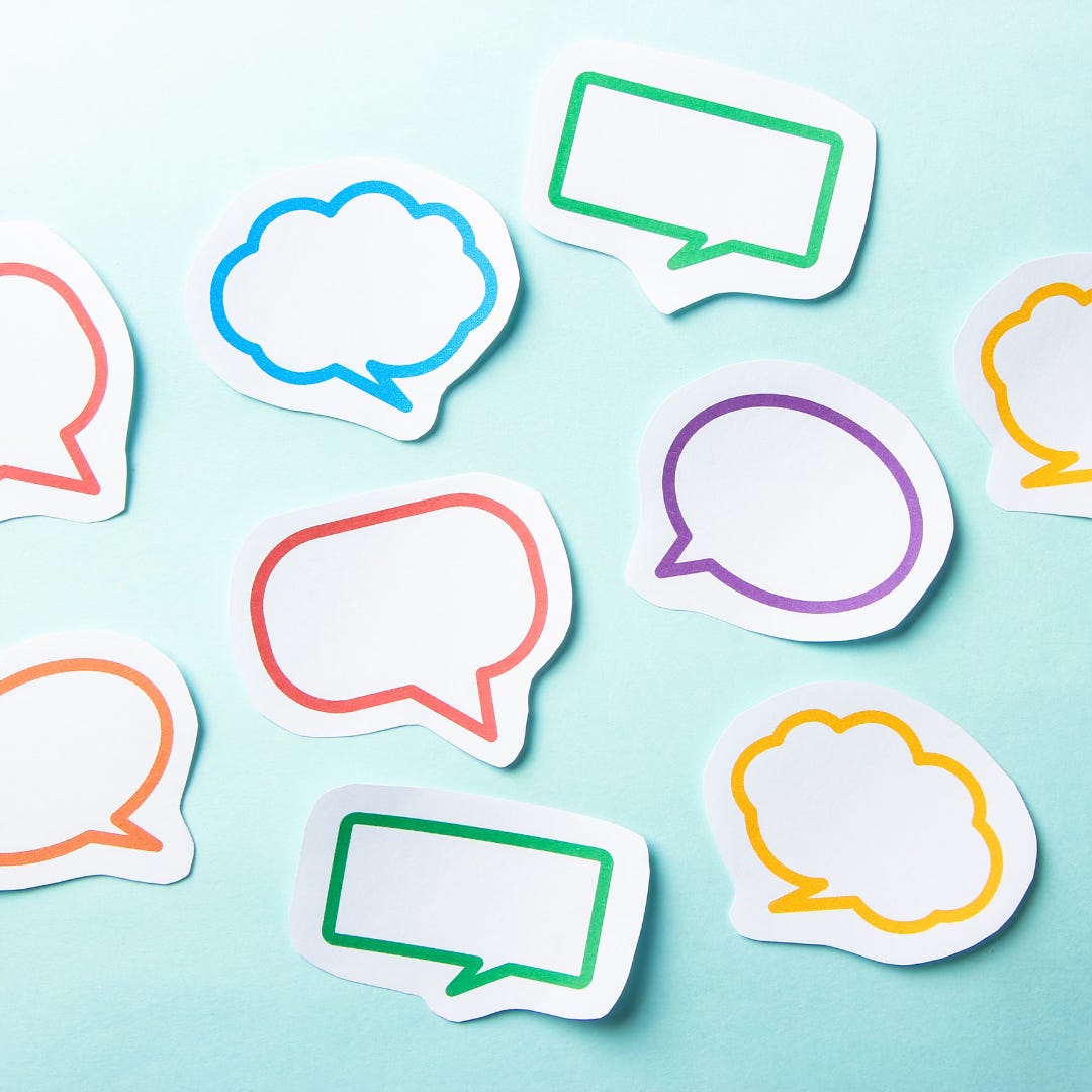 A light blue background filled with multi coloured thought and speech bubbles
