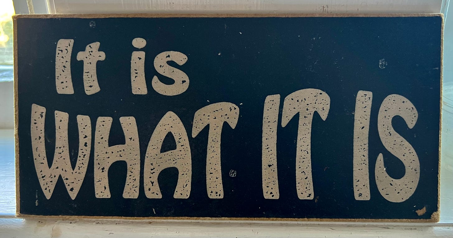 Wooden sign with stylized text reading "It is what it is." Wooden sign with stylized text reading "It is what it is."